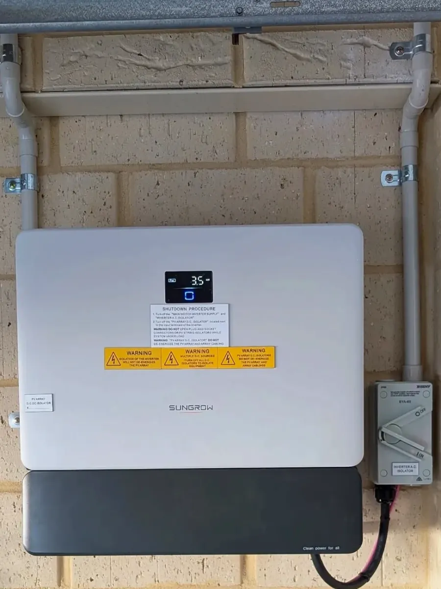 Sungrow inverter on a brick wall